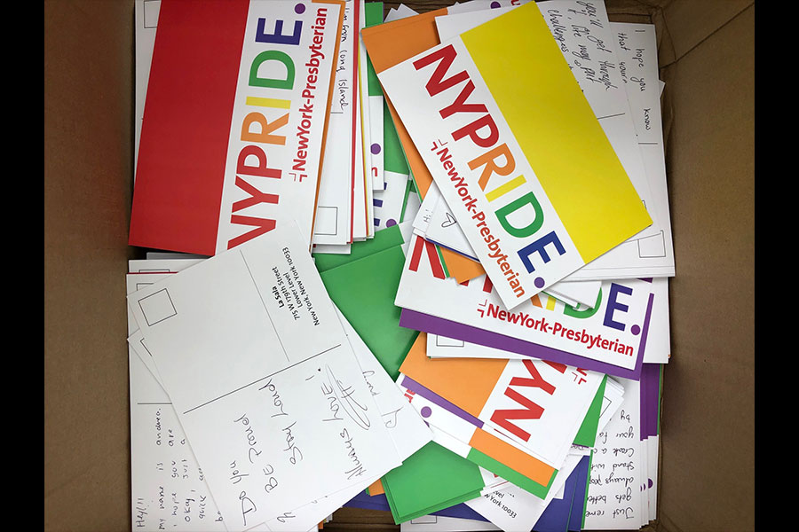A box full of LGBTQ Pride inspired NewYork-Presbyterian postcards