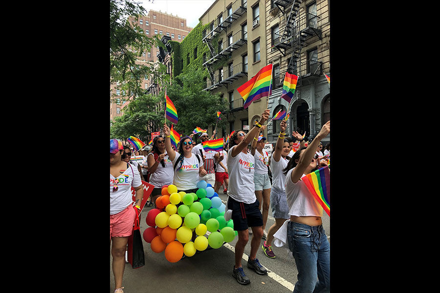 Group of people walking in pride parade