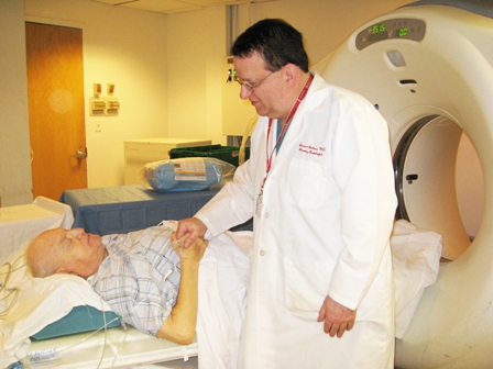 doctor talking to patient on MRI machine