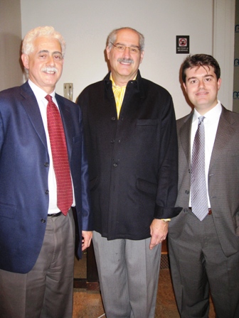 Three men standing next to each other 
