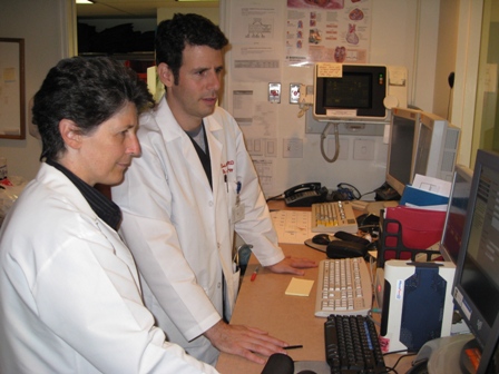Dr. David Benson and Dr. Gioia Turitto looking at a computer screen