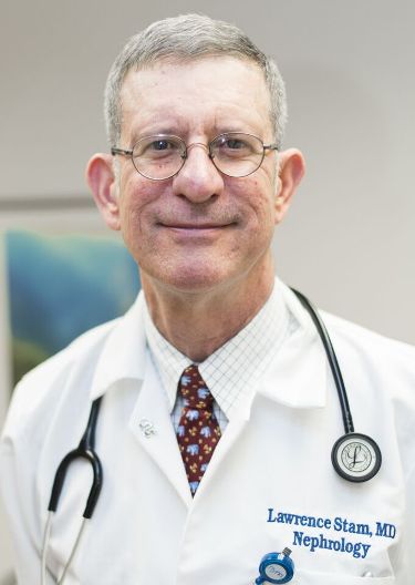 Lawrence Stam, M.D., works with patients undergoing kidney dialysis at NYM.
