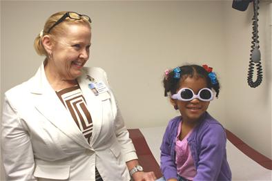 a person and a girl wearing goggles