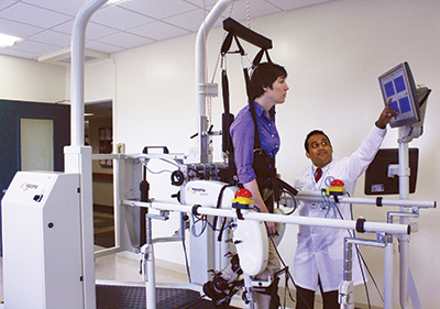 A patient uses a robotic orthosis machine for physical rehabilitation  at New York Methodist Hospital
