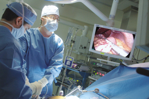 Piotr Gorecki, MD, uses laparoscopic surgical instruments that separate and seal the stomach