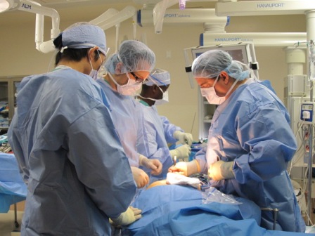 Richard Lazzaro, MD, stitching an incision