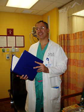 Photo of Dr. Eli Serur holding a clipboard