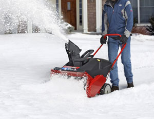 A person using a snow blower
