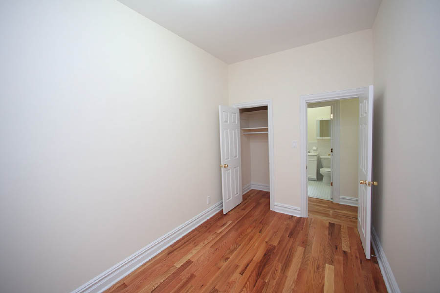 a room with white walls at 600 West 169 Street