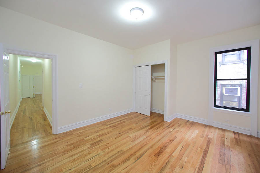 a room with a wood floor at 600 West 169 Street