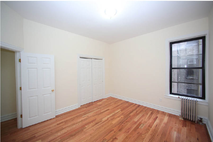 a room with white doors at 600 West 169 Street
