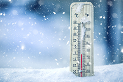 Thermometer in snow showing low temperatures