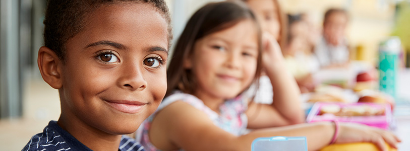 a close-up of a young girl and a young boy