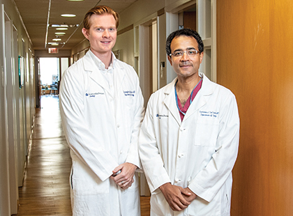 Dr. Christopher B. Anderson and Dr. G. Joel DeCastro