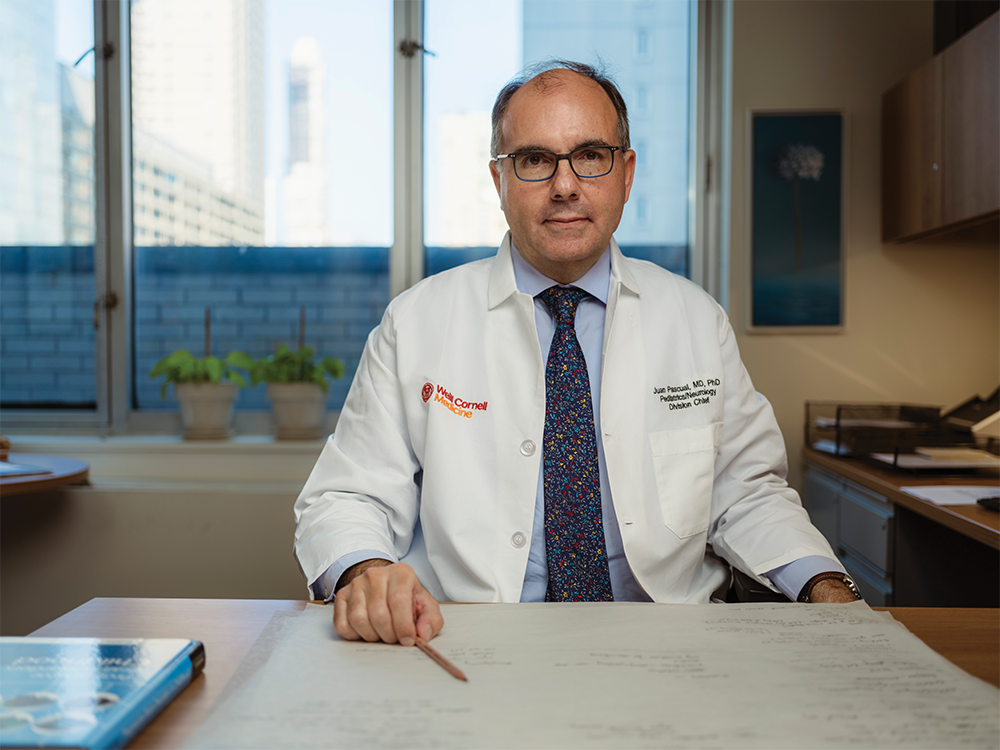 Doctor sitting at desk.