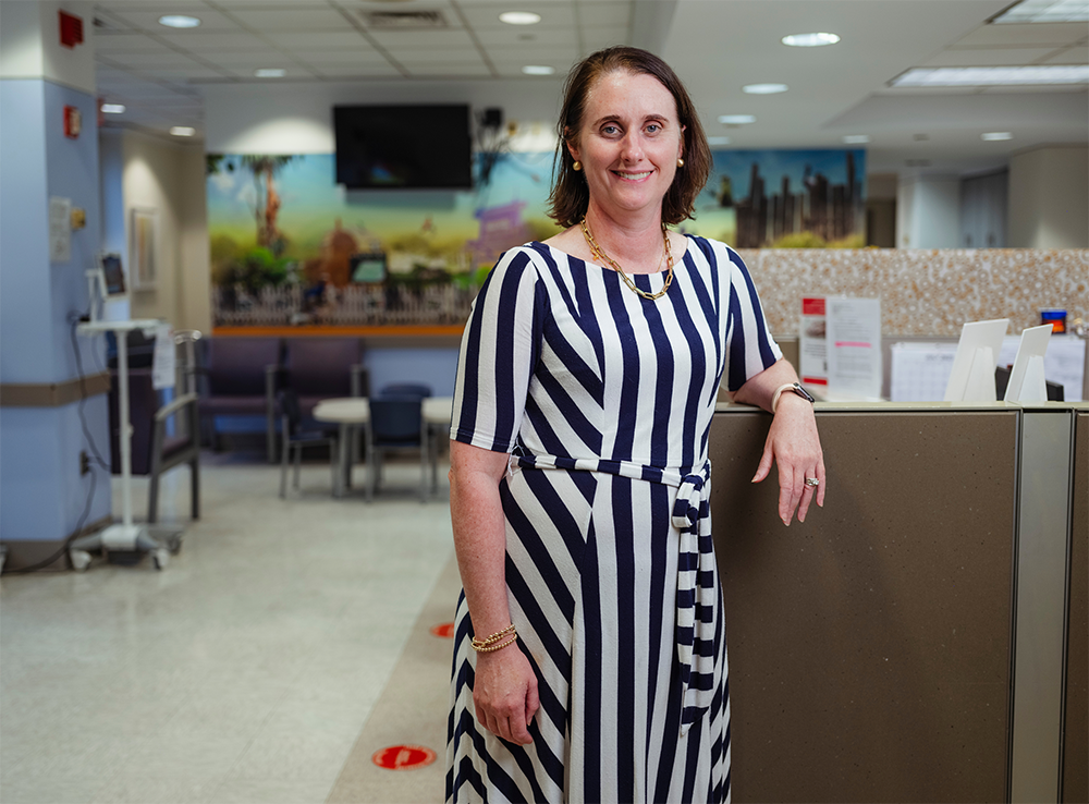 A woman in a black and white dress.