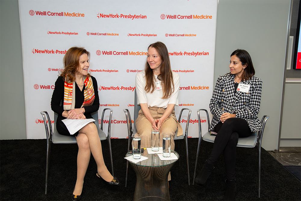 Group of three women sitting and talking.