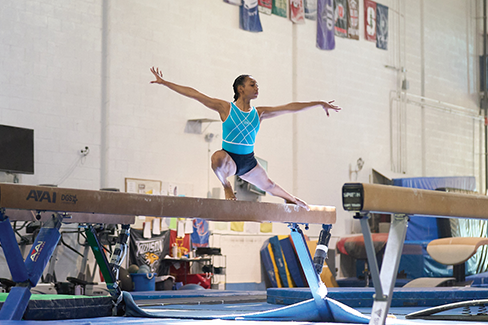 Gymnast on a balance beam.