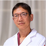 Man in a doctor's coat.