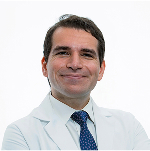 A man in a doctor's coat and tie.