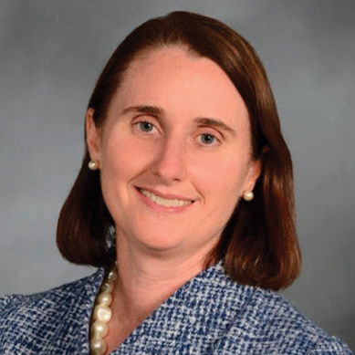 woman smiling straight ahead at viewer