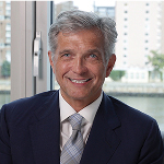 A white man in a suit and tie.