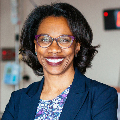 A woman in a navy blazer.