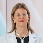 A woman in a doctor's coat.