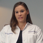 A woman in a lab coat.