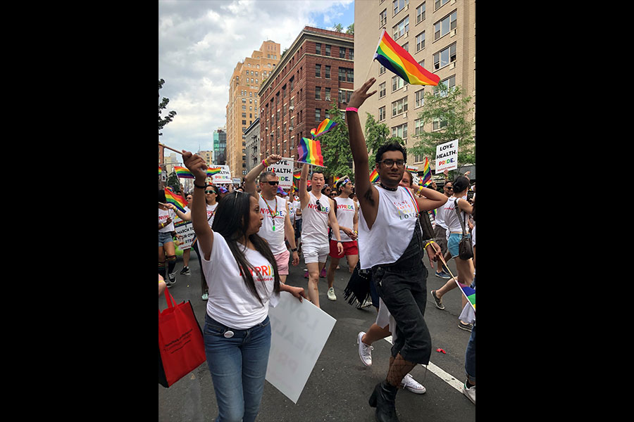 a group of people marching at pride parade
