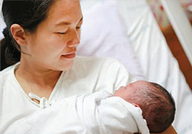 woman with a newly born infant