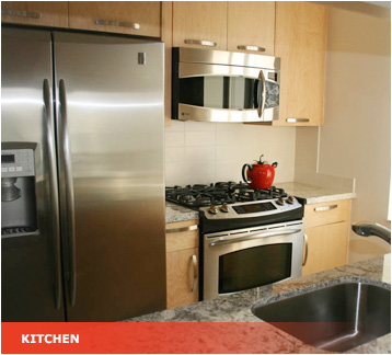 a kitchen with stainless steel appliances at Coleman Tower