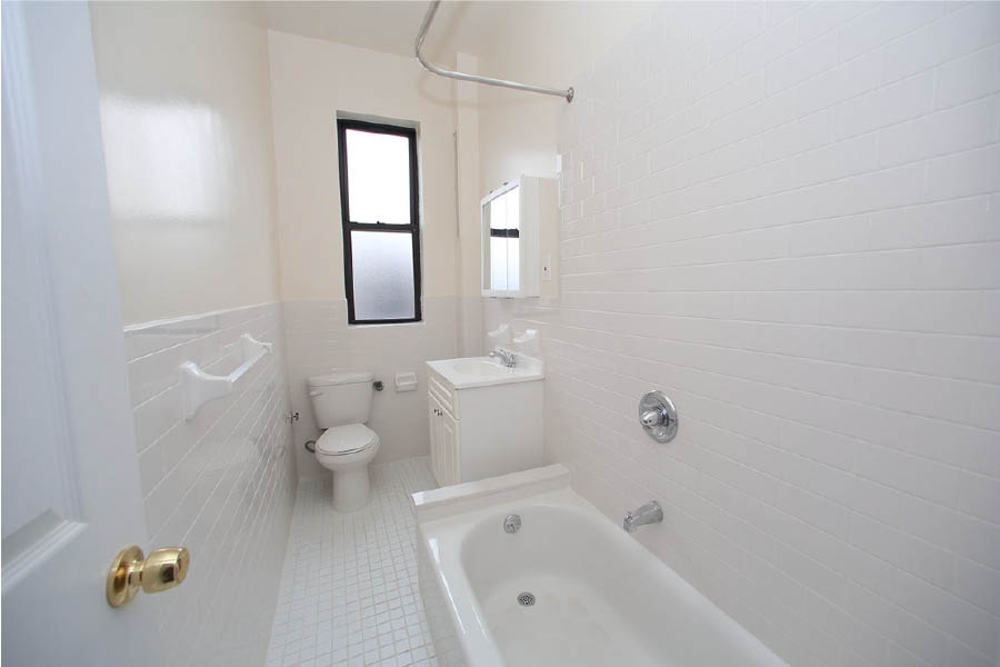 a bathroom with a tub toilet and sink at 601 West 164 Street