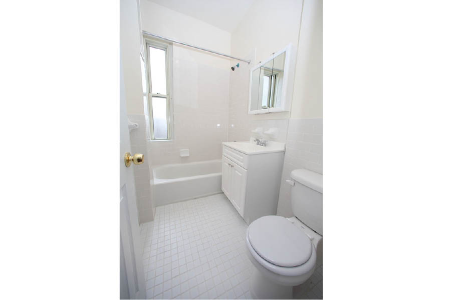 a bathroom with a toilet and tub at 625 West 169 Street