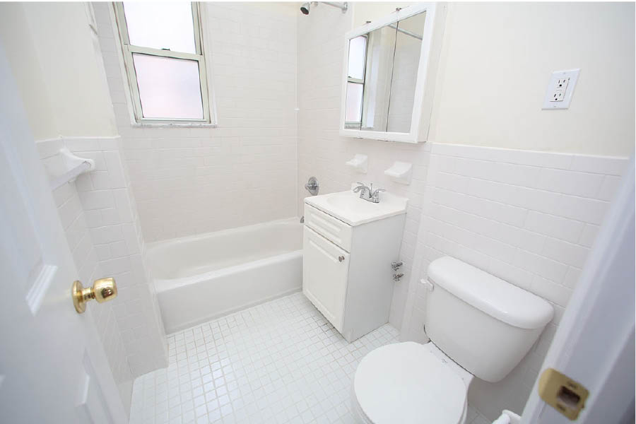 a bathroom with a toilet and sink at 625 West 169 Street