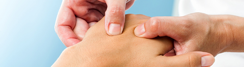 Close up of someone massaging a hand 