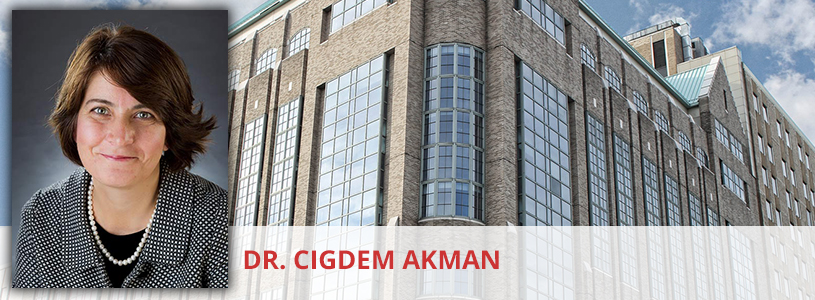 Dr. Cigdem Akman in front of a NewYork-Presbyterian hospital