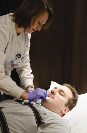 a doctor attending to a patient at the Otolaryngology Center for Sleep Disorders