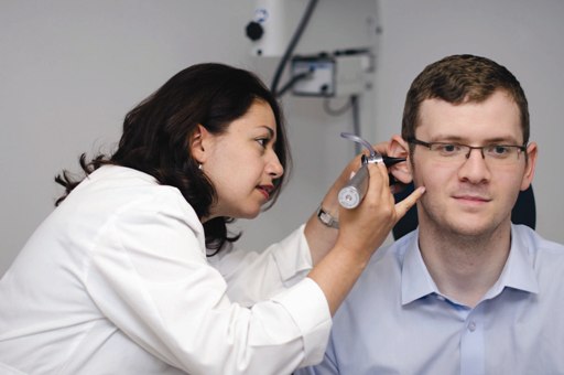 A doctor checking a patients ear