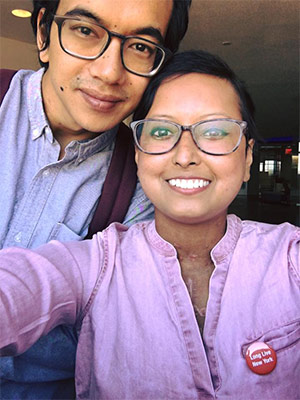 Prasha Tuladha taking a selfie with a man