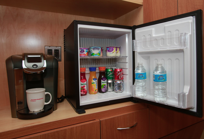 a small refrigerator with drinks and food