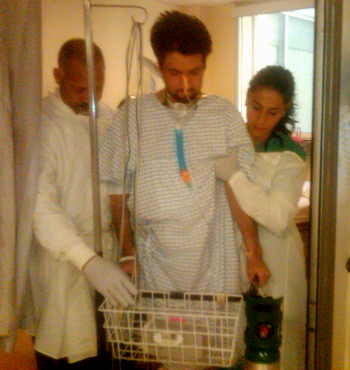 Curse and doctor helping patient walk