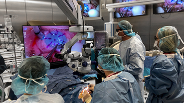 image of doctors performing eye surgery in an OR