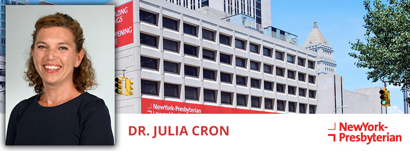 Dr. Julia Cron in front of a NewYork-Presbyterian hospital