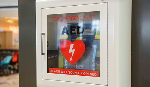An AED hanging on the wall