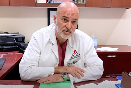 Dr. Emile Bacha sitting at his desk