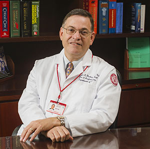 Dr. Fernando Martinez sitting at a table