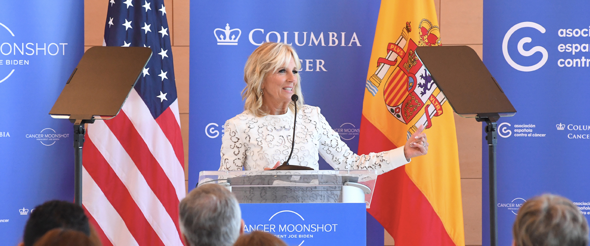 First Lady Jill Biden behind a podium as she delivers remarks.