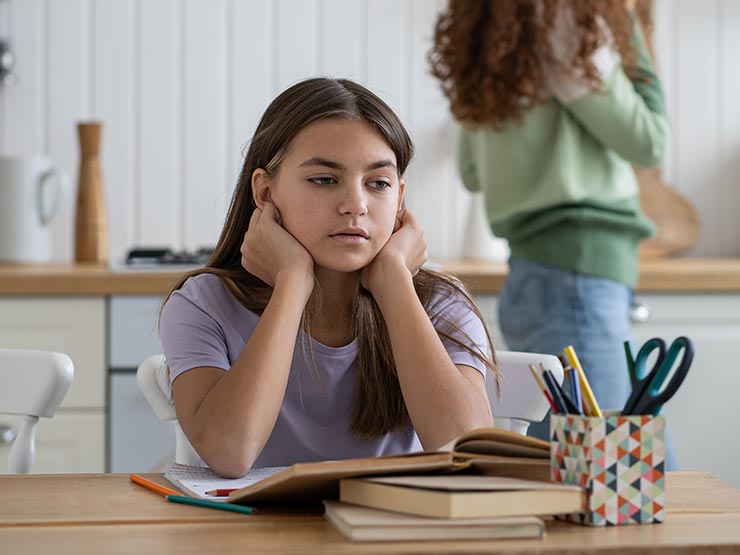 young girl staring off into space