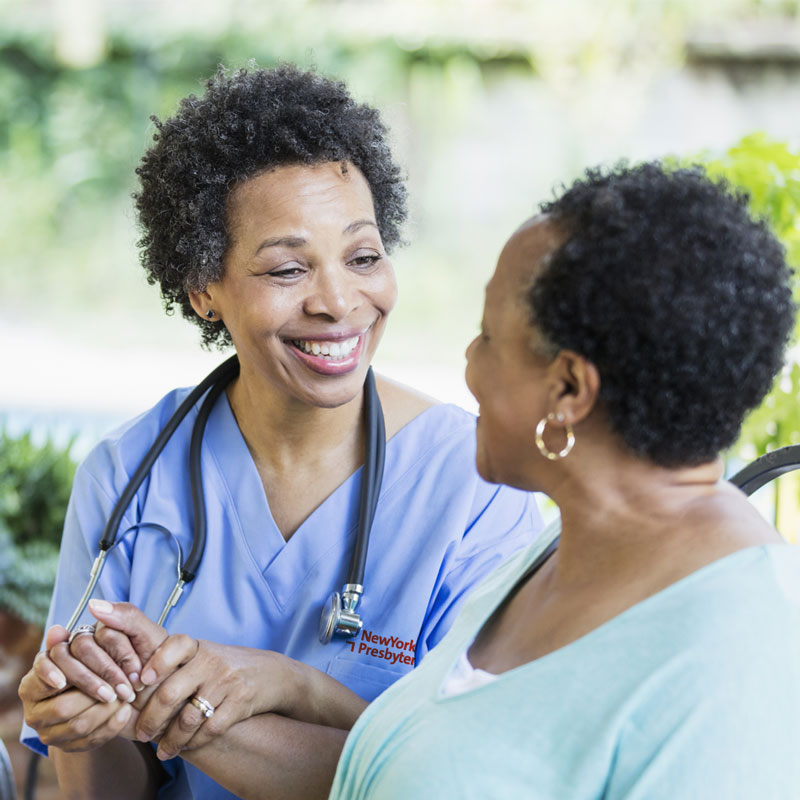 African American Clinician assisting elderly african american patient